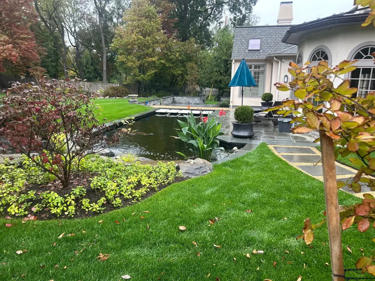 Landscape lighting around outdoor water feature