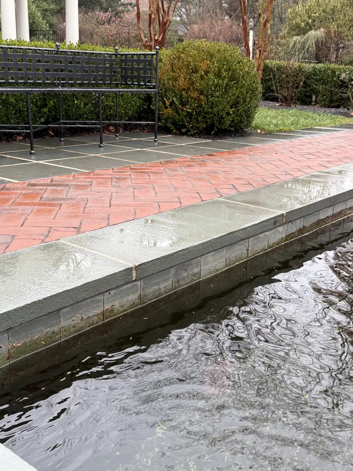 Pond leak repair in progress with liner patching materials